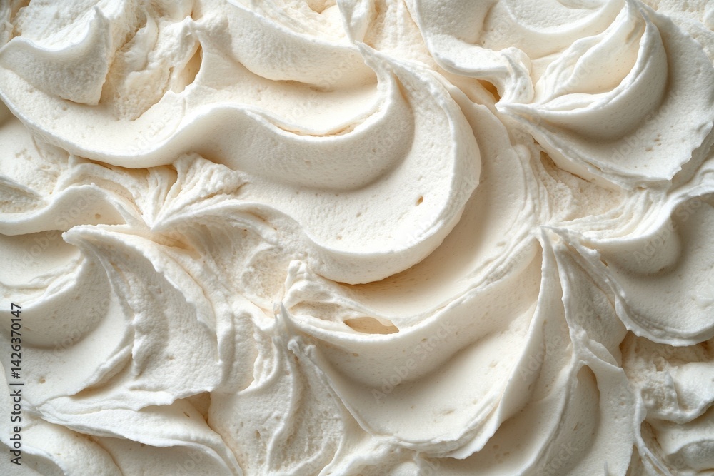 Poster whipped cream texture with decorative swirls in a close-up shot highlighting its smoothness and rich