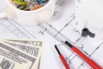 Electrical components using in electric installations, construction diagrams, work tools and dollar banknotes. Planning build or buy house