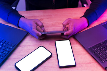 Man playing game on mobile phone. A modern smartphone with a white screen