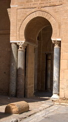 Fototapeta premium Old, Roman columns supporting an arched entrance in the Great Mosque of Kairouan in Kairouan, Tunisia