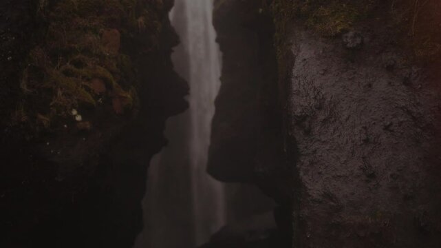 Powerful Waterfall in Iceland Cascading Down Rocky Cliffs