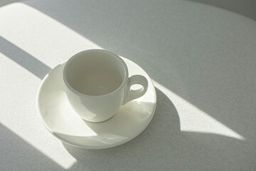 Ceramic cup with saucer isolated on white
