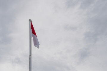  Vibrant Indonesian National Flag Fluttering Gently Against Overcast Sky Background