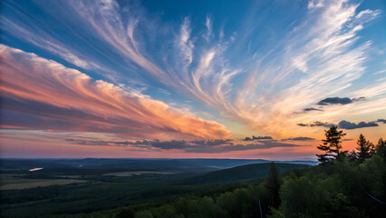 Obraz premium A breathtaking natural landscape featuring a wide, colorful sky during sunset.