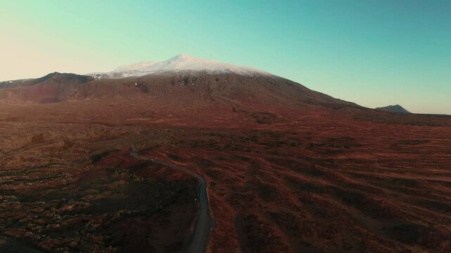 Car Driving Through Rugged Icelandic Landscape Near Glacier