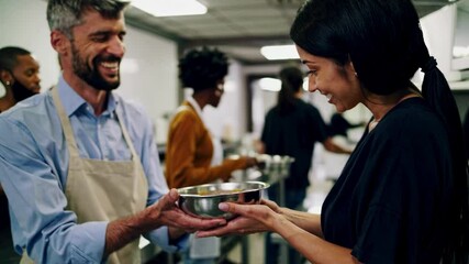 Diverse cooking class with chef instructor demonstrating culinary techniques
