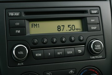 Fototapeta premium Close-Up of Car Radio Display Showing FM Frequency and Controls