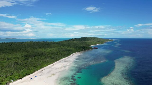 Maratua, Indonesia: Aerial drone footage of Maratua island with its turquoise lagoon in the Derawan archipelago in Kalimantan in Indonesian Borneo. 