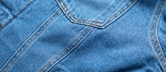 Fototapeta premium Blue denim background. Closeup view