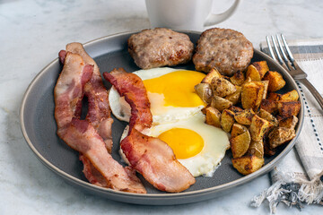  fried eggs  with bacon and sausage patties