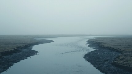 Fototapeta premium Misty River Channel Through Wetlands