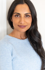 Beautiful Asian Indian woman in blue sweater.