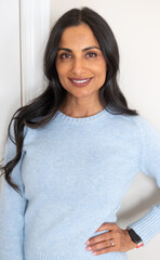 Beautiful Asian Indian woman in blue sweater.