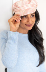 Beautiful Asian Indian woman wearing hat.