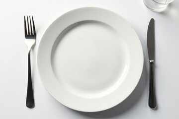 Close-up of empty plate, fork, and glass on white , restriction, hunger