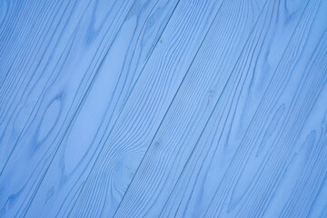 Diagonal blue wooden planks with visible wood grain. Seamless texture background for banner, poster, wallpaper, furniture, postcard, and interior design projects.