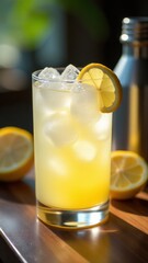 Chilled lemon cocktail with ice cubes, fresh mint, and lemon slices in a tall glass, perfect for a summer day or citrus-themed refreshment.