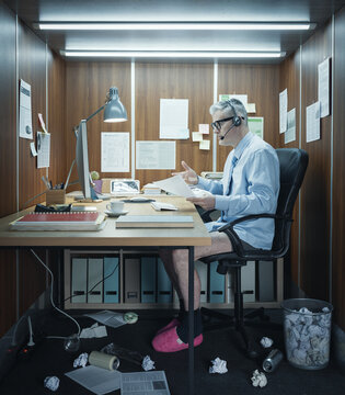 Funny businessman having a video call wearing a shirt and no pants