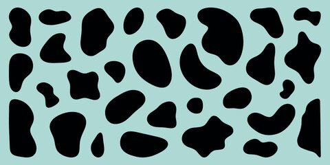 Abstract pattern with black oval shapes on a beige background. The black shapes create a striking contrast. Oval shapes repeat in a random pattern. Black shape vector set.