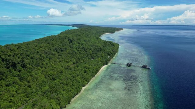 Maratua, Indonesia: Aerial drone footage of overwater bungalow in the idyllic Maratua island in the Derawan archipelago in Kalimantan in Indonesian Borneo. 