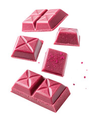 Ruby chocolate pieces are artistically falling, showcasing their vibrant pink hue and unique texture