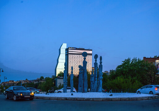 TBC Clocks - sculpture and hotels in distance in  Tbilisi