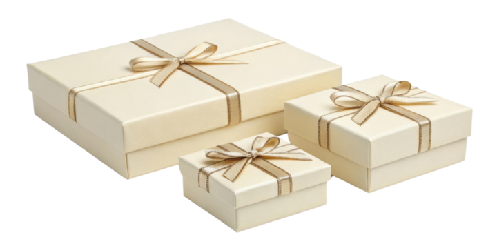 Cream colored gift boxes with elegant ribbons create charming presentation