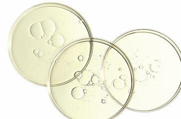 The texture of a cosmetic serum or body gel in a Petri dish.