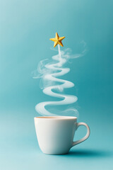Coffee mug with swirling steam shaped like Christmas tree topped with gold star. Holiday spirit concept.