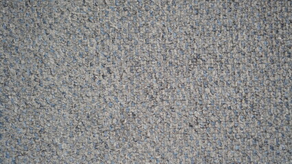 Detailed close-up showcasing the texture of a speckled grey and blue carpet