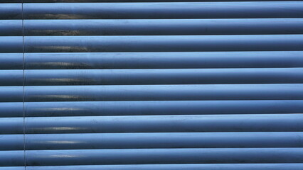 Obraz premium Abstract shot of horizontal window blinds, subtle light and shadow effect