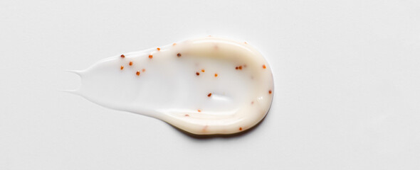 A sample of a cosmetic body care scrub. White background.