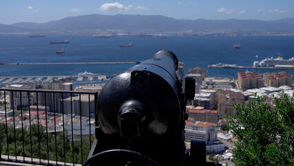 Old cannon overlooking Gibraltar city, harbor and Algeciras Bay - GIBRALTAR, UK - MARCH 31, 2025