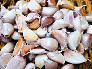 Fresh organic garlic on brown background.