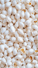 Obraz premium Close up of puffy white popcorn kernels creating a textured background