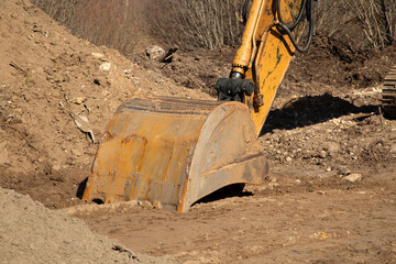 An excavator that works in a sand pit.