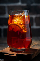glass of fresh iced tea with lemon, vertical closeup