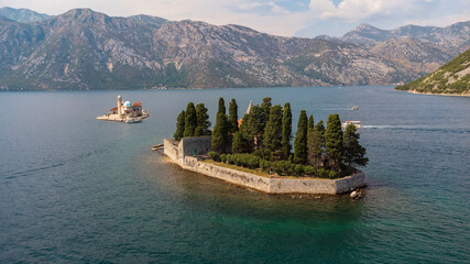 Aerial view of St. George Island surrounded by sea. Tourist attraction of the ancient monastery on the island near Perast, in the Bay of Kotor, Montenegro