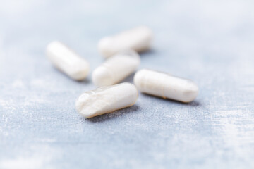 Coenzyme Q10 capsules. Antioxidants. Concept for a healthy dietary supplementation. Bright background. Soft focus. Close up. Copy space.