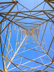 Nadir view of a high-voltage metal tower