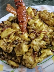 
A rich and spicy goat brain fry, cooked with aromatic Indian masala and whole spices. The dish is savory, flavorful, and served hot, making it a classic delicacy for meat lovers.