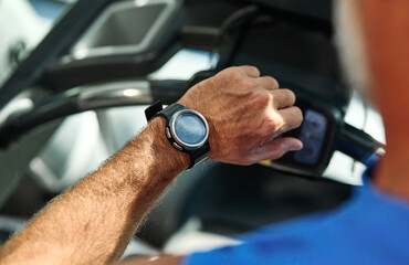 gym sport fitness exercising training mature man running watch smart time smartwatch wristwatch device app checking pulse monitor performance cardio treadmill