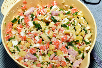A bowl of prepared salad called Olivier.