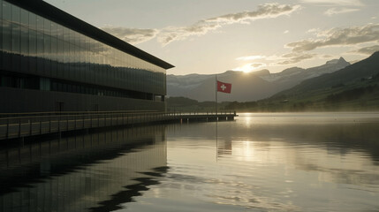 Modern glass building with Swiss flag reflecting on alpine lake, representing financial stability, banking security and Swiss precision in architecture.