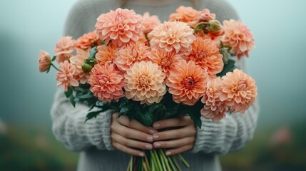 Soft Peach Dahlias Held Gently