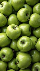 Close-up view of fresh green apples. Juicy fruit with bright, vibrant color, full frame composition. Healthy eating theme, ideal for food industry, organic produce, for food markets, grocery stores.
