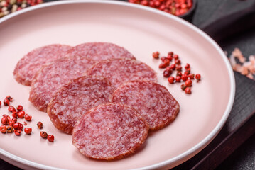 Sliced salami sausage, smoked meat, delicious deli snacks