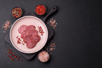 Sliced salami sausage, smoked meat, delicious deli snacks