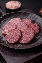 Sliced salami sausage, smoked meat, delicious deli snacks