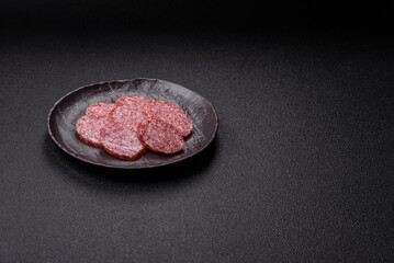 Sliced salami sausage, smoked meat, delicious deli snacks
